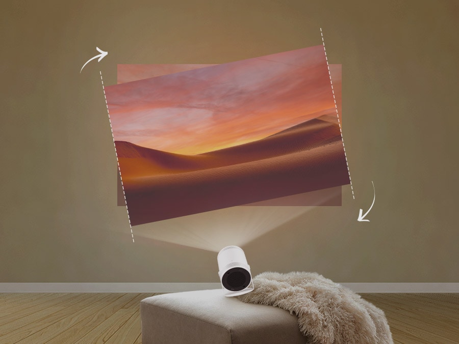 The Freestyle on an uneven couch casts a crooked picture of a sand dune on the wall. The picture automatically adjusts into a level picture.