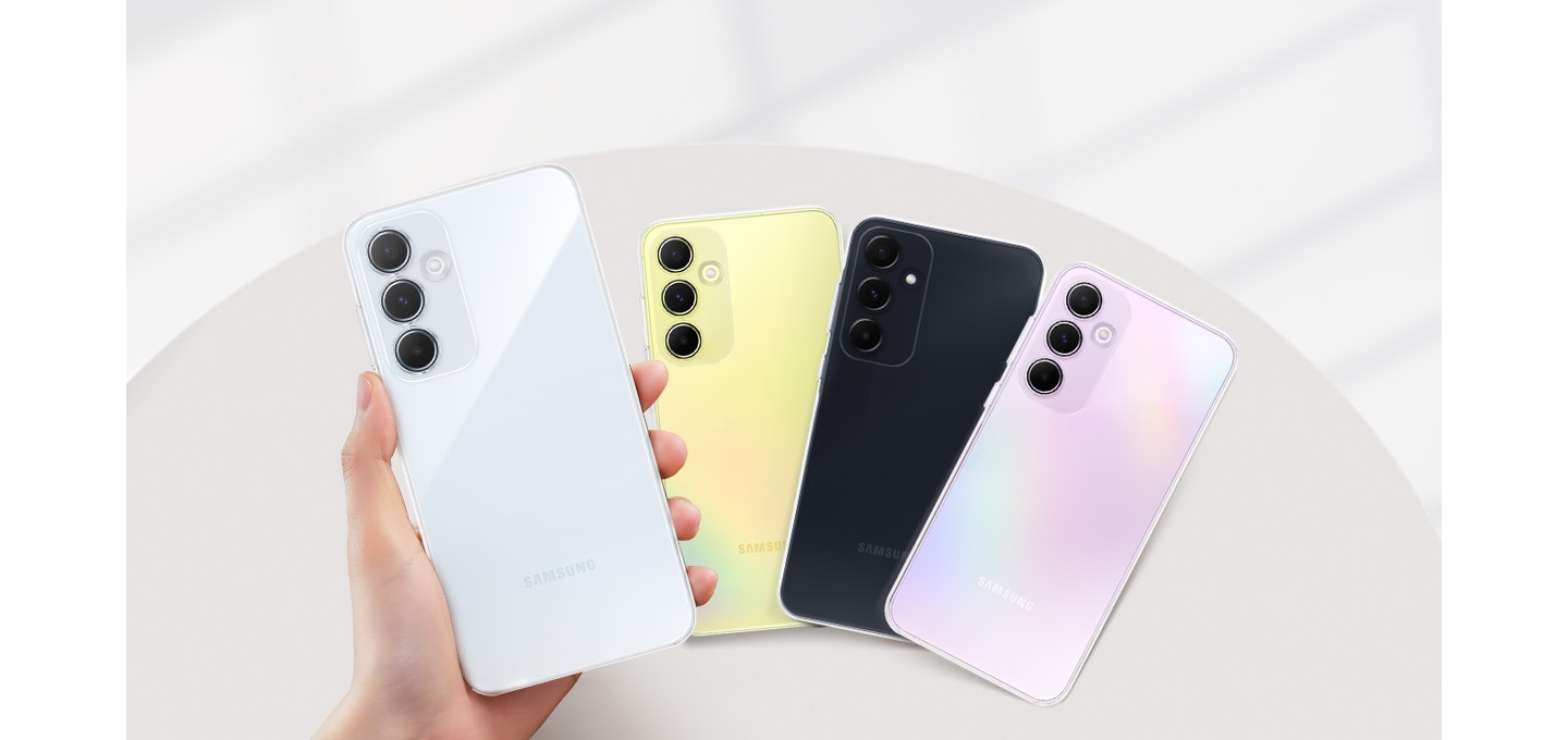 Four Galaxy devices in Iceblue, Lemon, Navy and Lilac are shown wearing Clear Cases. The leftmost, Iceblue Galaxy device is held by a hand while the others are placed on a table.