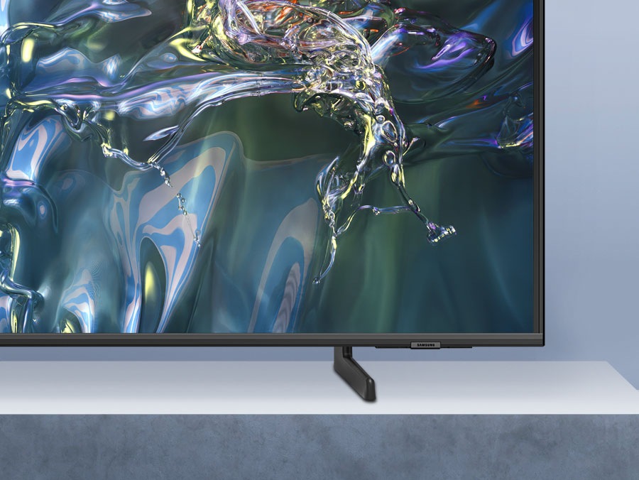 A QLED TV is placed on an Adjustable Stand.