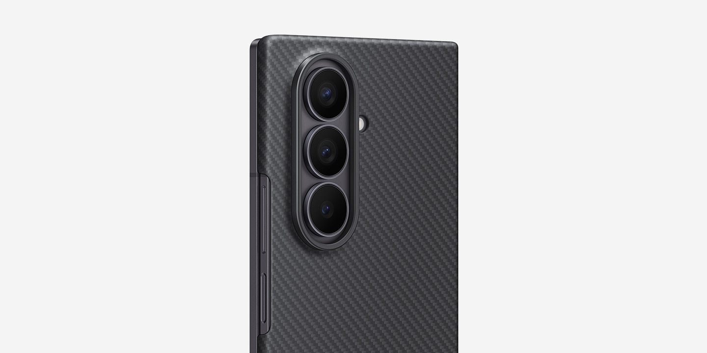 Close-up view of the Galaxy Z Fold7 with the Back Cover facing forward at a slight side angle. The Galaxy Z Fold7 is displayed in the Carbon Shield Case in Black highlighting the slimness of the case.