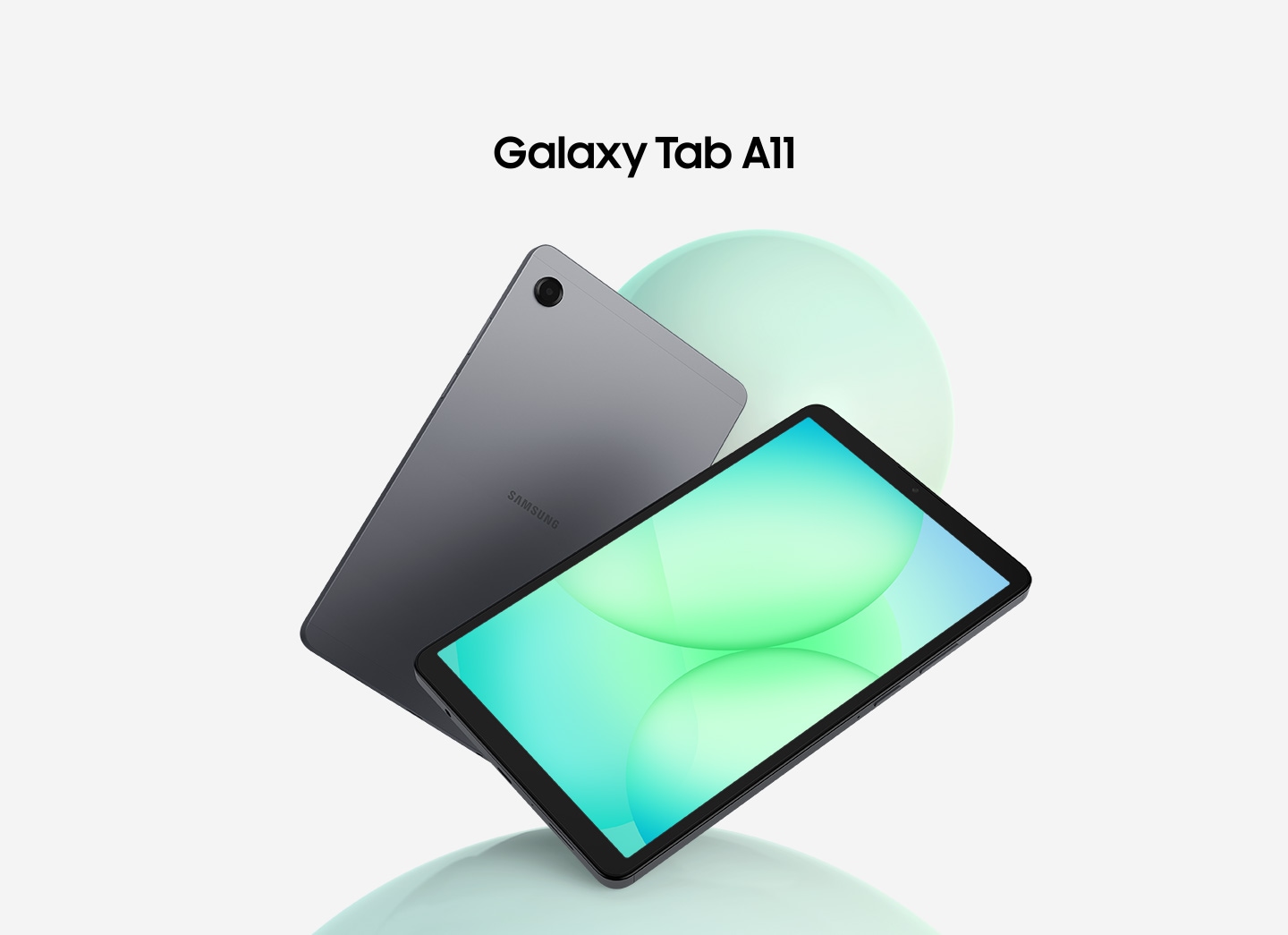 Two Galaxy Tab A11 tablets are arranged in a fan layout. The first one on the left show its back in and gray, while the front-facing tablet displays a greenish circular patterned graphic on its screen. Above the tablets, the text reads 'Galaxy Tab A11'.