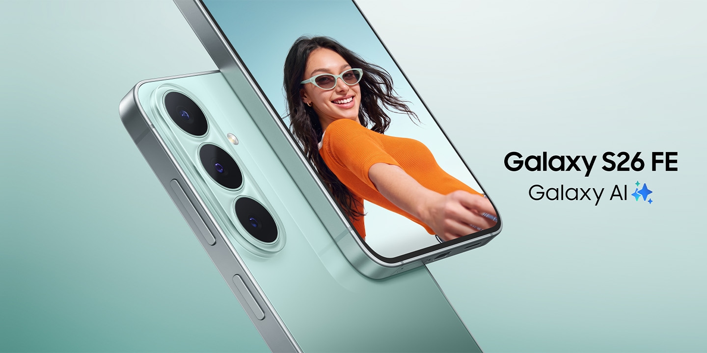 A close-up of two Galaxy S26 FE devices in Pistachio. One device is shown from the back, highlighting the triple rear camera design, while the other faces forward, displaying a vibrant photo of a smiling person wearing sunglasses. Galaxy S26 FE, Galaxy AI logo shown.