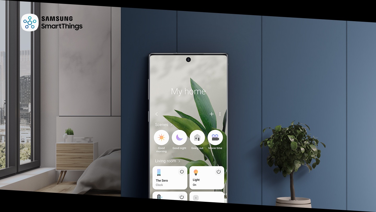 A large mobile phone leans on a wall showing the SmartThings app, with controls for The Sero, lighting, and robot vacuum. Then it shows controls in portrait, including My Photo, Cinemagraph, and Sound Wall, demonstrating Sound Ring. Then the device slides down, revealing The Sero in portrait mode. 