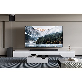 A living room with a TV, Samsung Soundbar Q800D and a subwoofer.