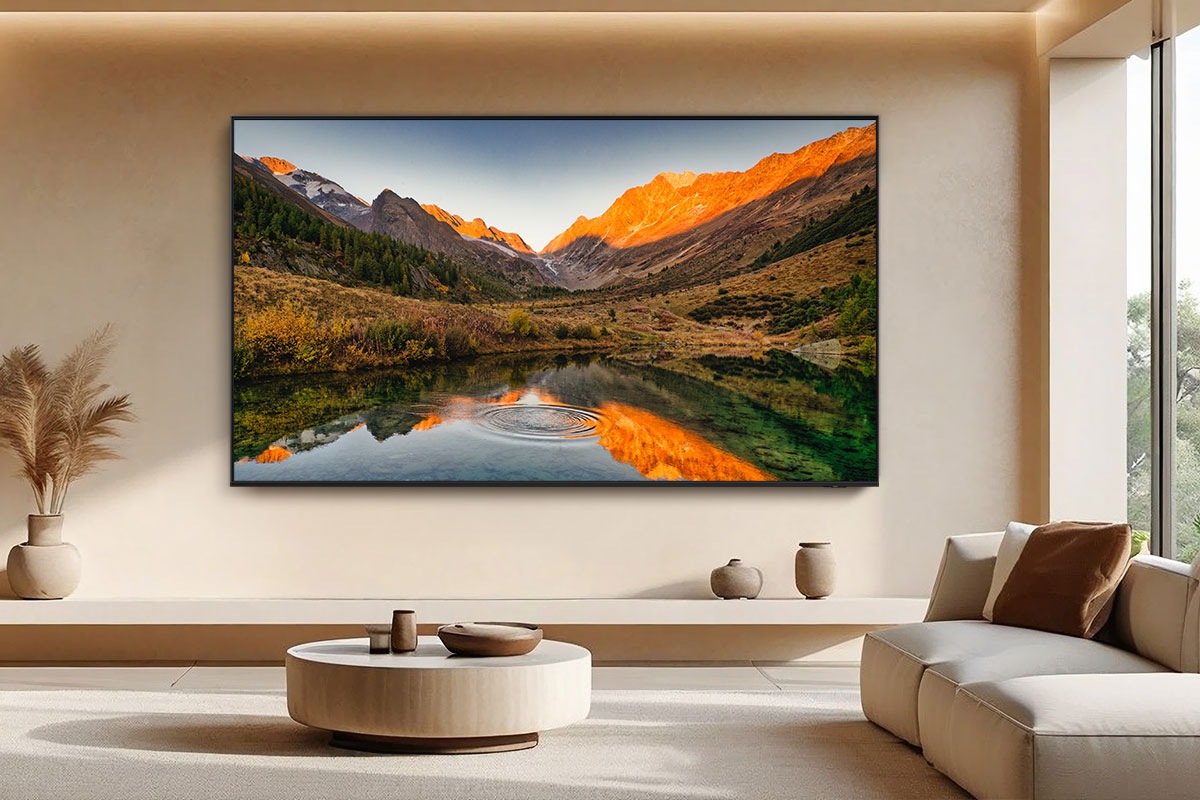 Large Samsung Neo QLED TV in modern living room displays a crisp natural landscape scene.