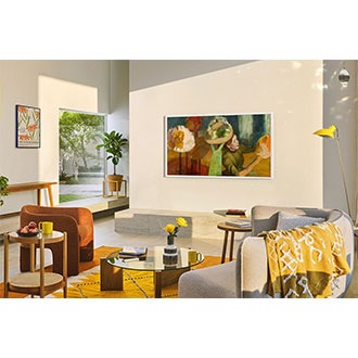 The Frame is mounted to a wall in a living room.