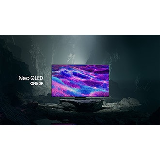 Samsung Neo QLED QN80F TV in a black and white underground space displays a colorful scene of an otherworldly landscape.