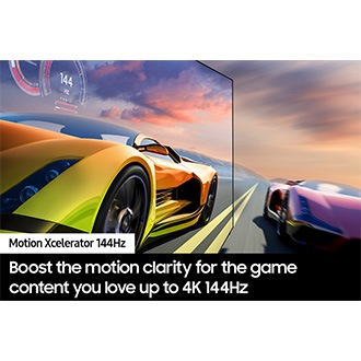 2 race cars are racing on a track. 1 looks clearer than the other and is going faster.