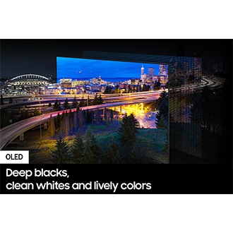 A city lit up by bright lights is on display. The colors and lights are vivid as OLED lights portray through the QD screen.