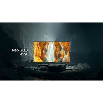 Samsung Neo QLED QN70F TV in a black and white underground space displays a colorful scene of an otherworldly landscape.