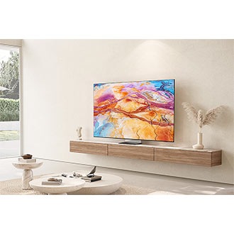 QN900D sits elegantly on top of a console in a warm living room.