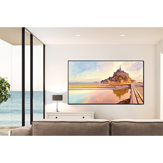 QN90D is wall-mounted in a clean white living room.