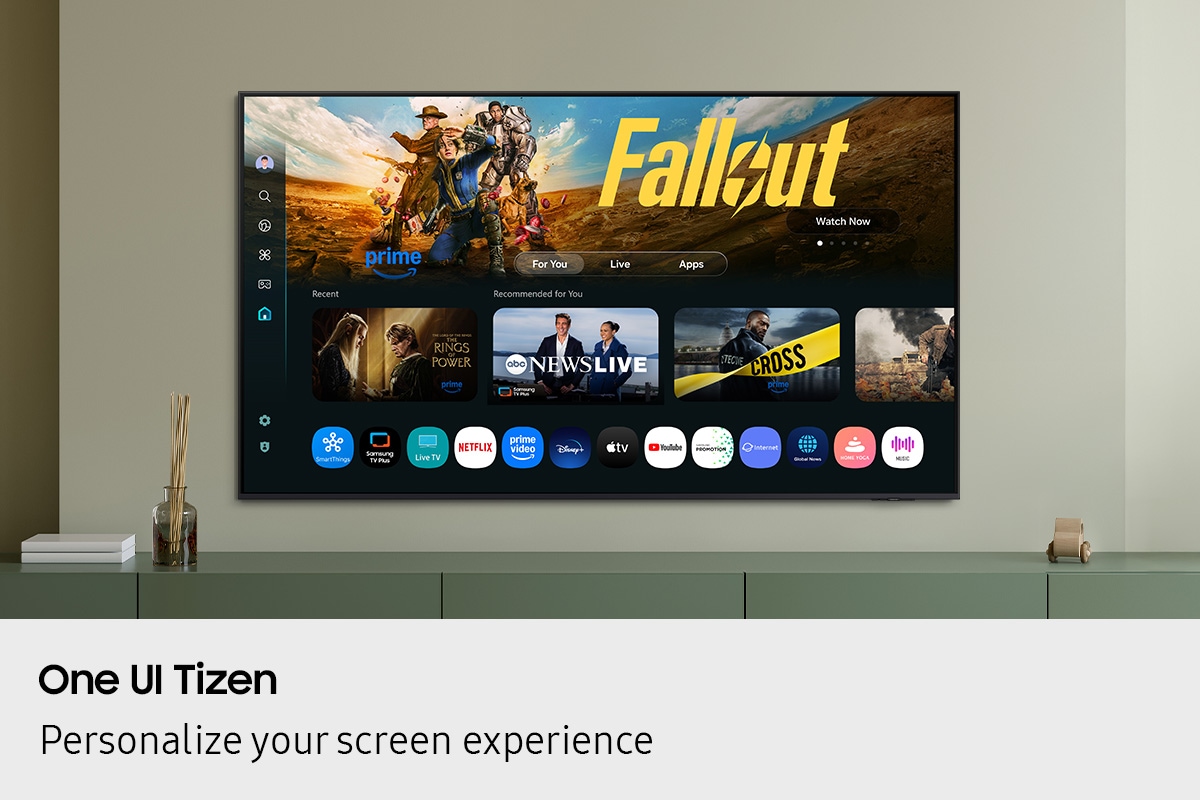 One UI Tizen’s home screen, with the various apps and services available, is displayed on a TV in a living room.