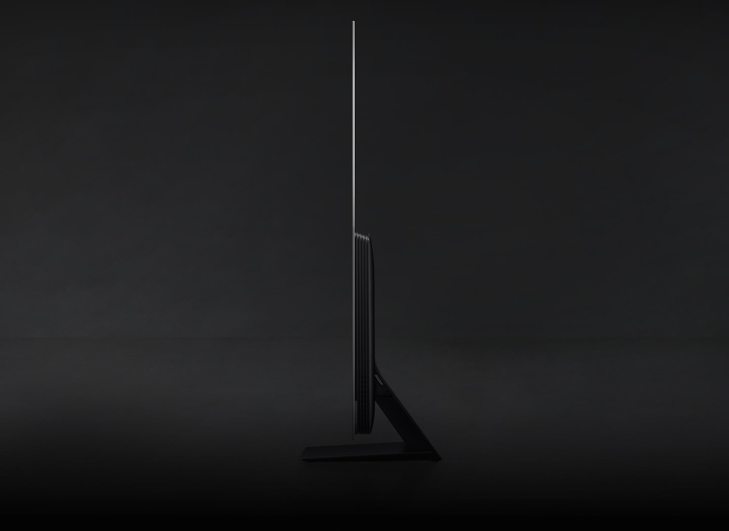 A OLED TV turns sideways to show its laser-slim design from the side.