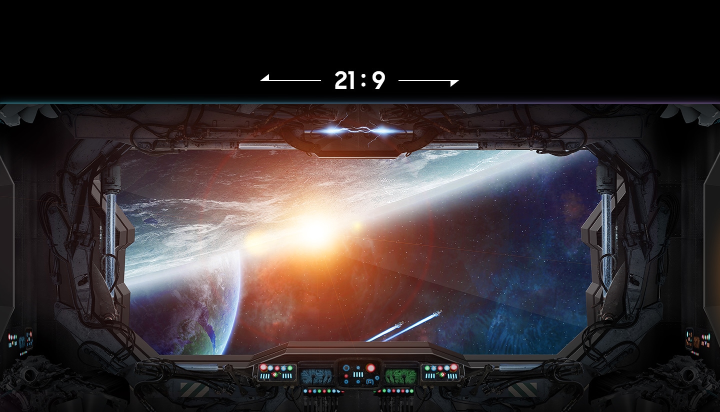 The monitor screen zooms out to show 21:9 ratio, before zooming out further to show 32:9 ratio. 32:9 reveals a wider view from the spaceship windscreen to show more of the space landscape on the left and right.