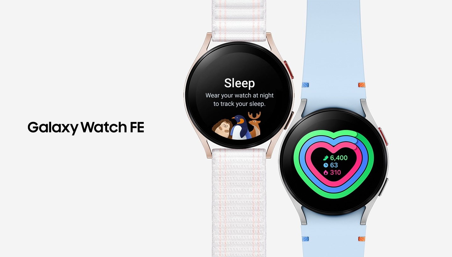 Two Galaxy Watch FEs are seen from the front. The pink Gold one on the left has a white fabric band attached. Its watch face displays a sleep tracking interface with a hedgehog and a penguin resting on a yellow crescent moon. The message reads: 'Sleep. Wear your watch to track your sleep.' The silver one on the right has a sky-blue stitch band attached. Its watch face displays the total steps (6400), exercise duration (63 minutes), and calories burned (310 Kcal).