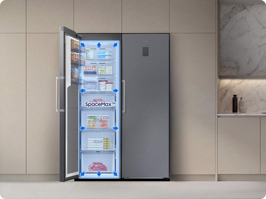 The door of the refrigerator is open. Arrows indicate increased internal space, enabled by SpaceMax™ technology.