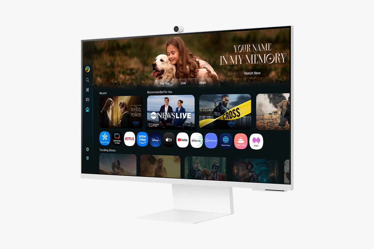 Front-right perspective of 32 inch Samsung Smart Monitor M8. Screen showing Smart TV Apps page with various content and apps lined up.