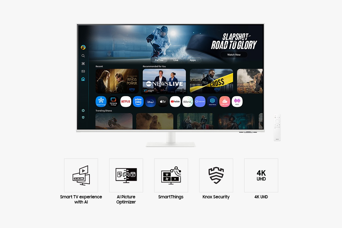 Front of 43 inch Samsung Smart Monitor M7 with the screen showing Smart TV Apps page with various content and apps lined up, and a remote control. Five icons for features about Smart TV experience with AI, AI Picture Optimizer, SmartThings, Knox Security, and 4K UHD.