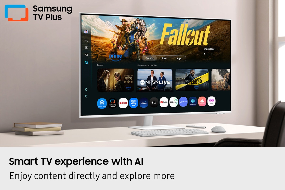 Smart TV experience with AI. Enjoy content directly and explore more. Monitor on desk displays Smart TV Apps page with various content and apps lined up. Samsung TV Plus logo.