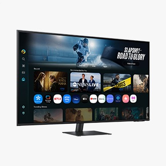 Front-left perspective of 43 inch Samsung Smart Monitor M7. Screen showing Smart TV Apps page with various content and apps lined up.