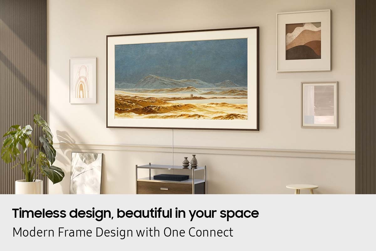 The Frame TV displays art and blends seamlessly into a refined living room wall with minimalist framed artwork.