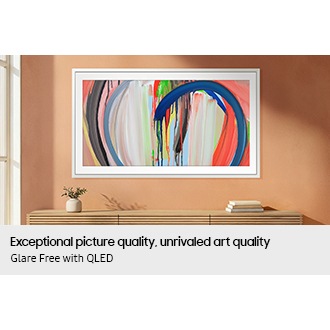 The Frame TV displays vivid abstract art without reflections, showing clear color and detail on its glare‑free QLED screen in a bright room.