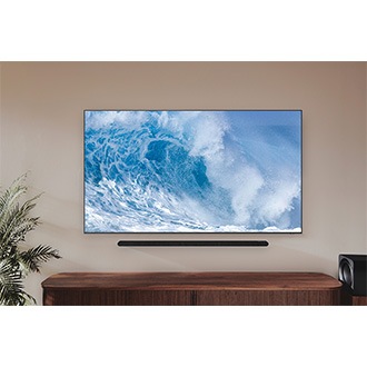 Samsung Neo QLED QN700B with the ultra slim soundbar is hanging on the living room.