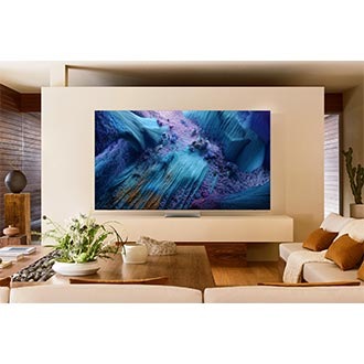 A Neo QLED TV is set on a stand in a living room. It displays a blue abstract landscape on screen.