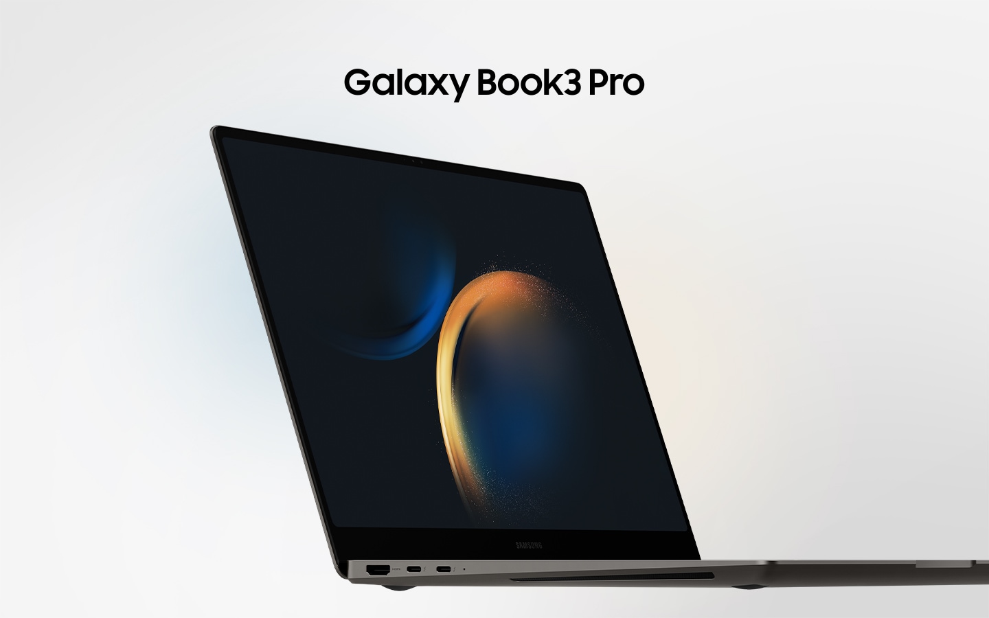 A graphite Galaxy Book3 Pro is opened, facing slightly right with a black wallpaper onscreen.