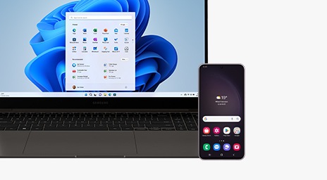 A graphite Galaxy Book3 Pro is opened and facing forward with the MS Home Screen shown onscreen. A Galaxy S23 Plus device is placed in front of the laptop with the Home Screen shown onscreen.