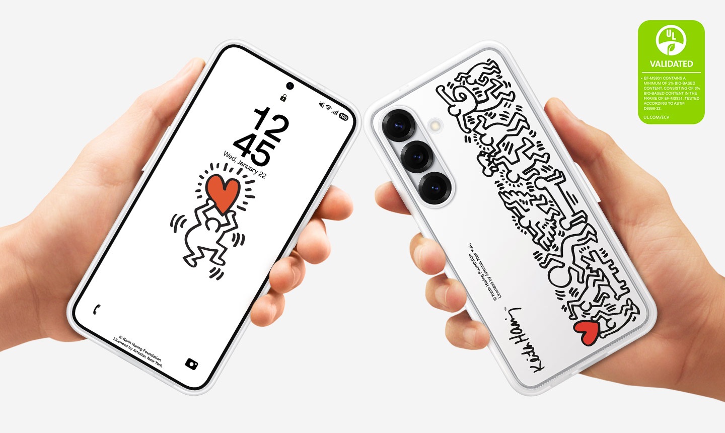 Two hands each hold a Galaxy S25, both installed with the Flipsuit Case. One shows the smartphone from the screen side and the other shows it from the back, where the case's Keith Haring graphic is shown. On the upper right corner is a UL Environmental Claim Validation Mark that reads 'EF-MS931 CONTAINS A MINIMUM OF 2% BIO-BASED CONTENT. CONSISTING OF 8% BIO-BASED CONTENT IN THE FRAME OF EF-MS931. TESTED ACCORDING TO ASTM D6886-22. UL.COM/ECV'.