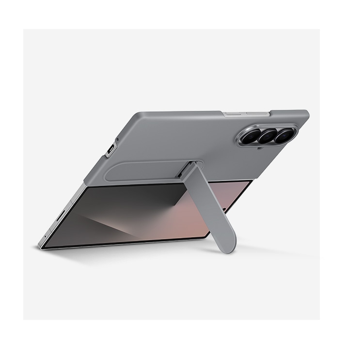 A Galaxy Z Fold7 is unfolded in landscape mode with the Silicone Case in Gray on. The case's stand supports the device, which is propped up and at a slight angle.