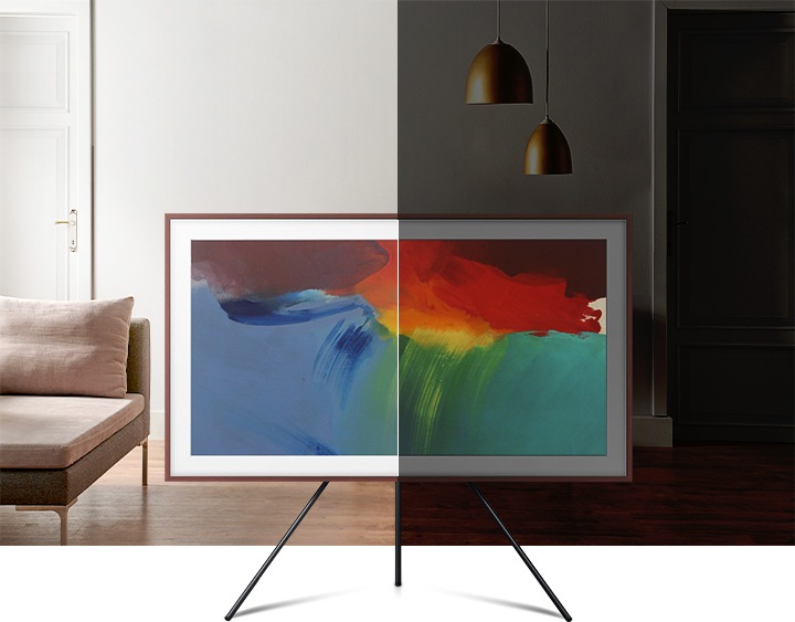 The effect of The Frame's brightness sensor is shown. On the left side, brightness levels of the on-screen artwork matches the brightness level of living room. On the right side, the brightness levels of the image is lowered to match the low-light setting of living room.