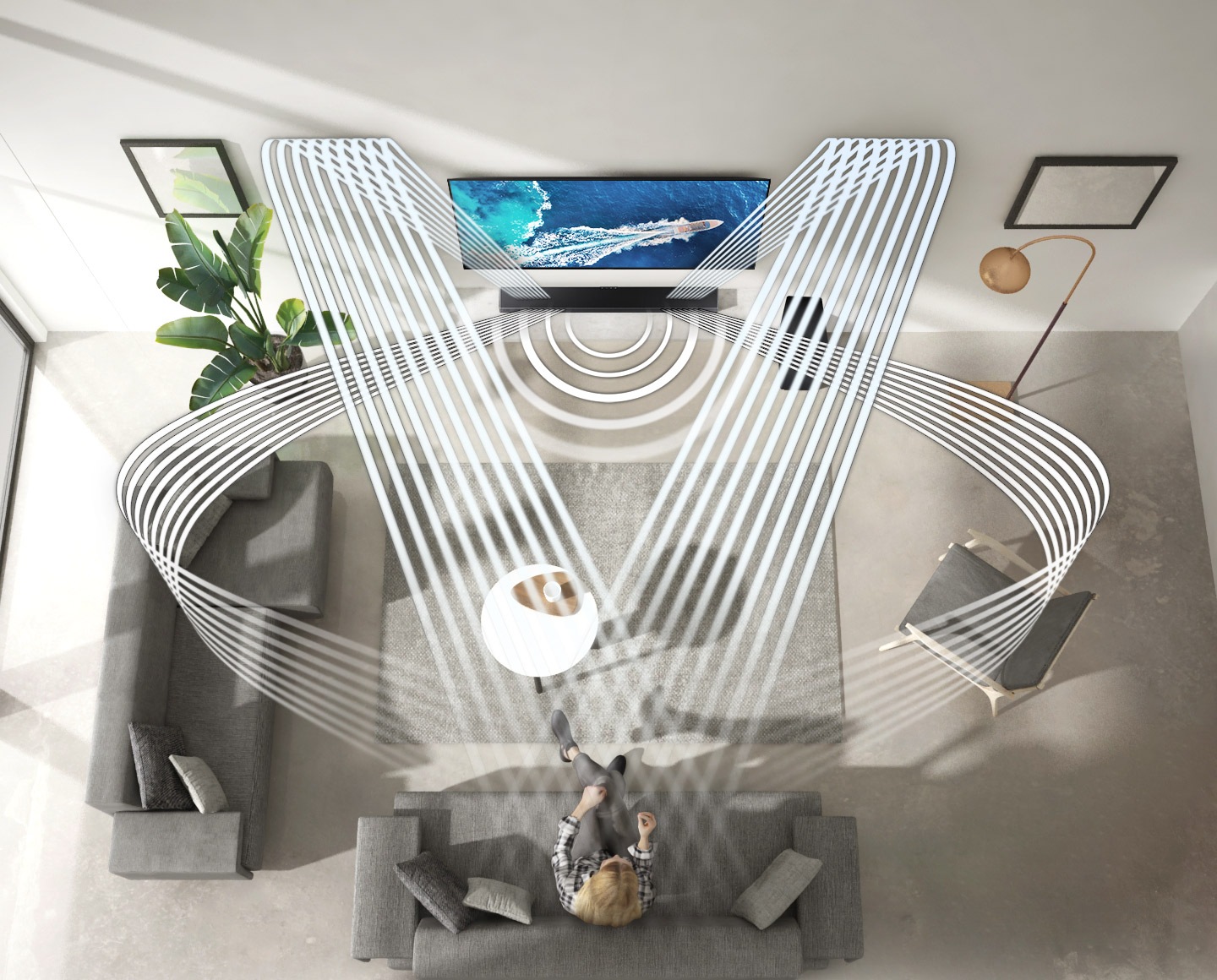 Various soundwave graphics coming from soundbar illustrate how the woman enjoying QLED TV in her living room experiences sound created by Samsung Acoustic Beam. 2 soundwave graphics are up-firing from the top of the soundbar and toward the woman. 3 soundwave graphics are coming from the side and center of the soundbar and toward the woman.