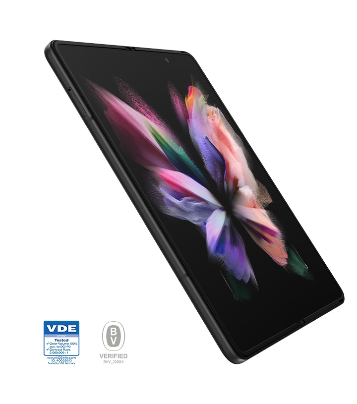 Unfolded Galaxy Z Fold3 5G seen at an angle with a colorful wallpaper on the Main Screen. VDE logo. Bureau Veritas logo.