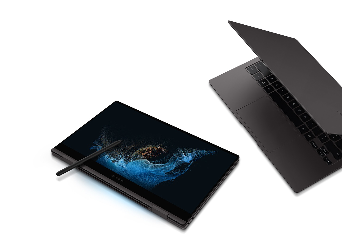 Two graphite-colored Galaxy Book2 Pro 360 devices are next to each other. The one on the left is folded like a tablet and an S Pen is placed on the screen that has a blue wavy wallpaper. The one on the right is half open and is facing towards the Galaxy Book2 Pro 360 on the left.