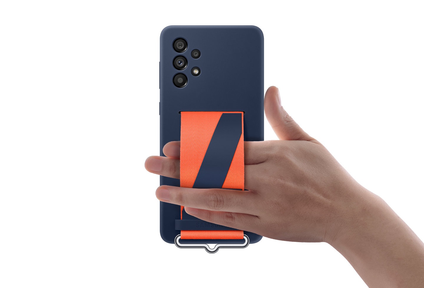 The backside of a Galaxy A73 5G wearing a navy Silicone Cover with strap is shown. A hand is using the strap to comfortably hold the device.