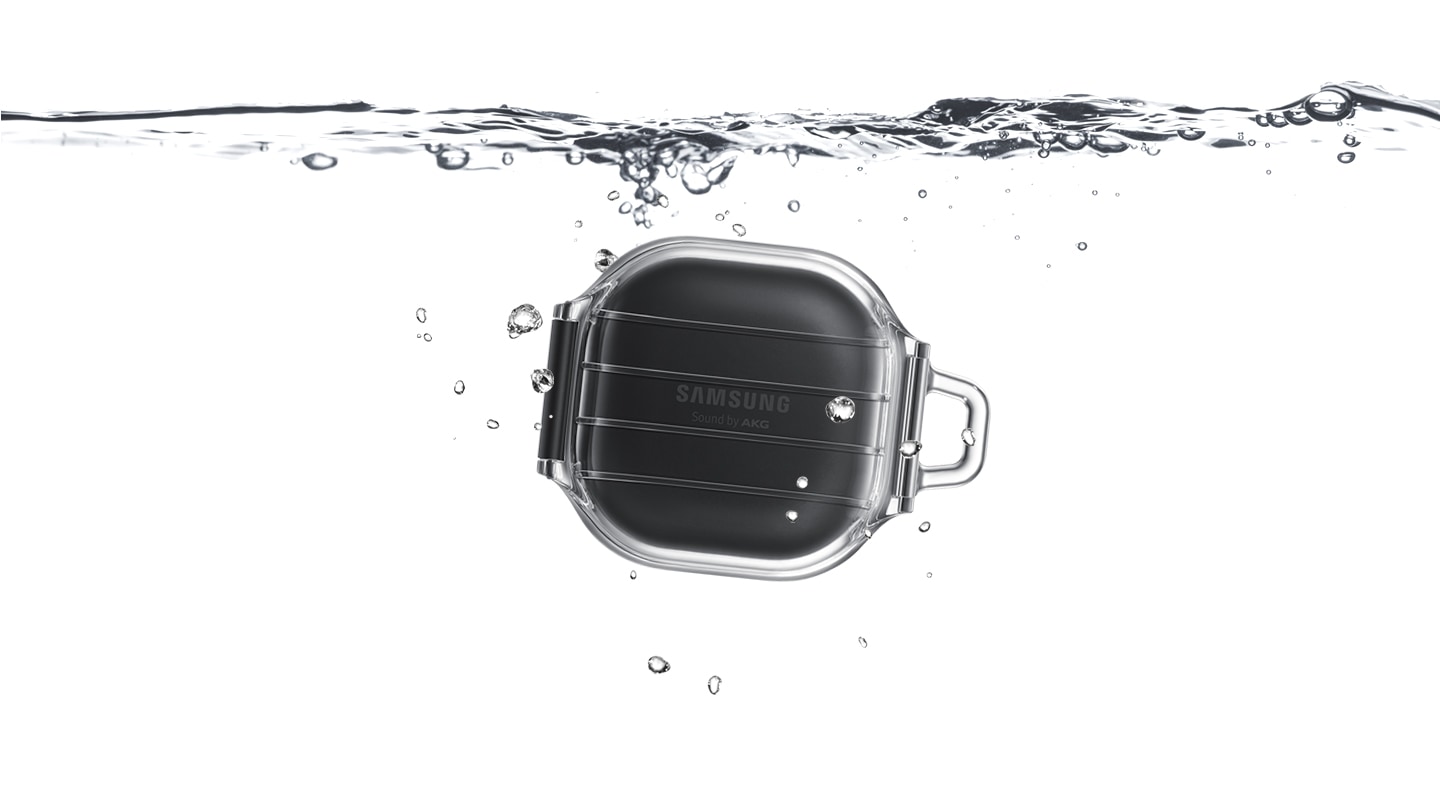 Galaxy Buds Pro in Phantom Black seen inside the transparent Protective Cover. It is underneath water to demonstrate the IP67 water resistance.