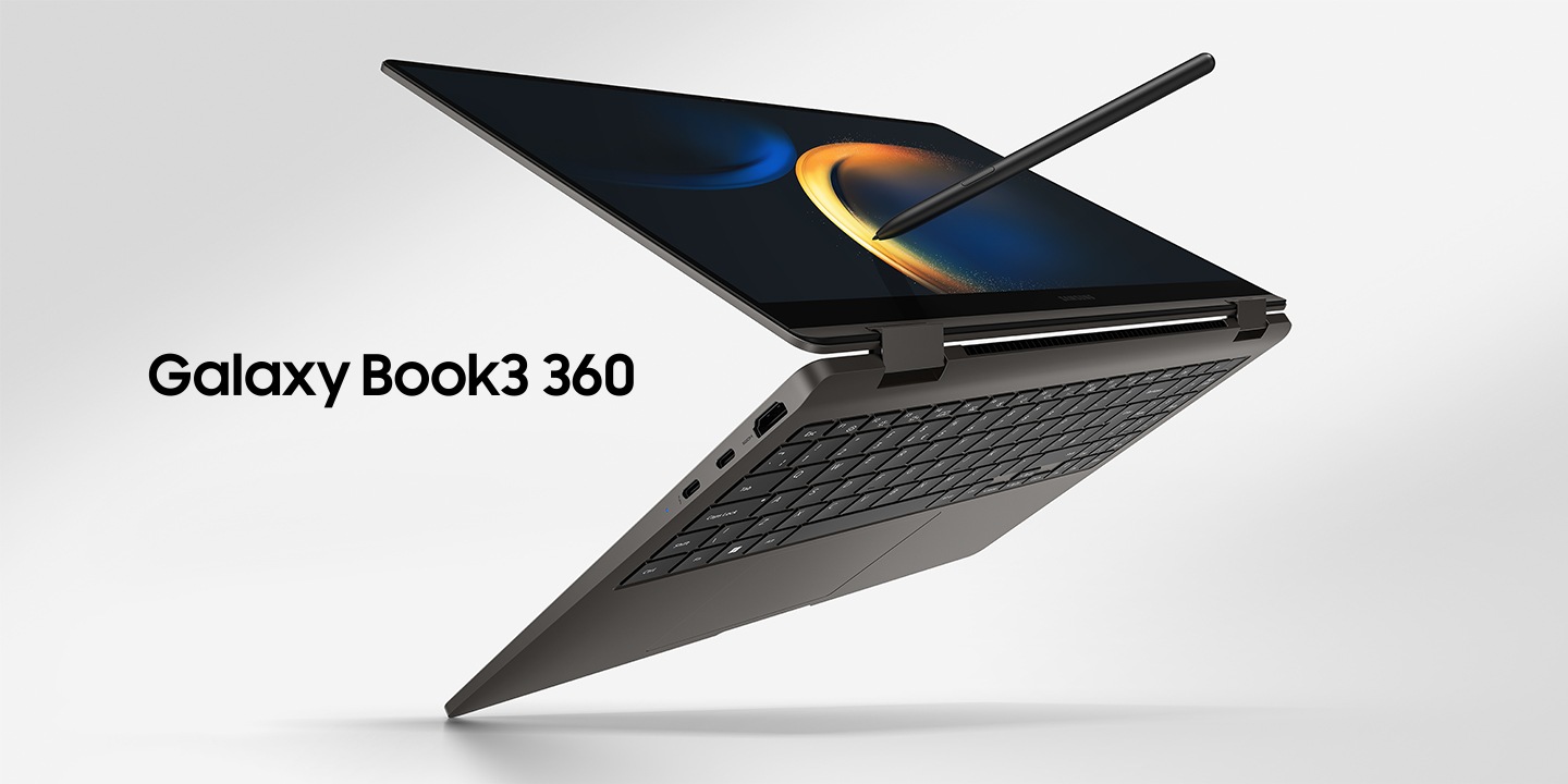 A graphite-colored Galaxy Book3 360 is folded slightly back, facing right with a black wallpaper onscreen and an S Pen touching the screen.