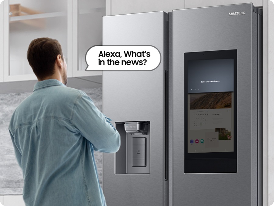a man is asking to refrigerator “alexa, what’s in the news?”.