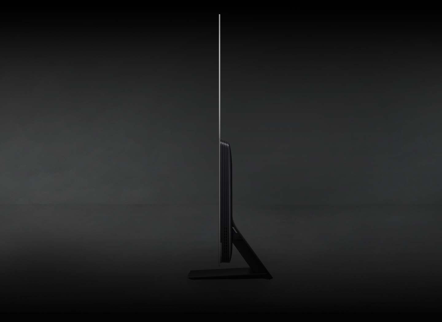 An OLED TV displaying nature flips sideways to show its laserslim design.