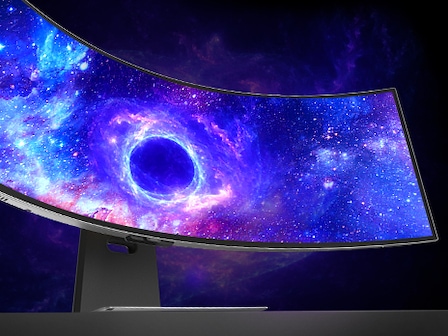 The monitor shows a black hole in space on the screen.