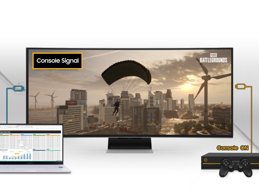 An Odyssey monitor is shown alongside a laptop and gaming console and the laptop's cable is running to the monitor. But as the console turns on, connecting to the monitor, it changes PC signal to console's and displays the game scene from PUBG Battlegrounds.