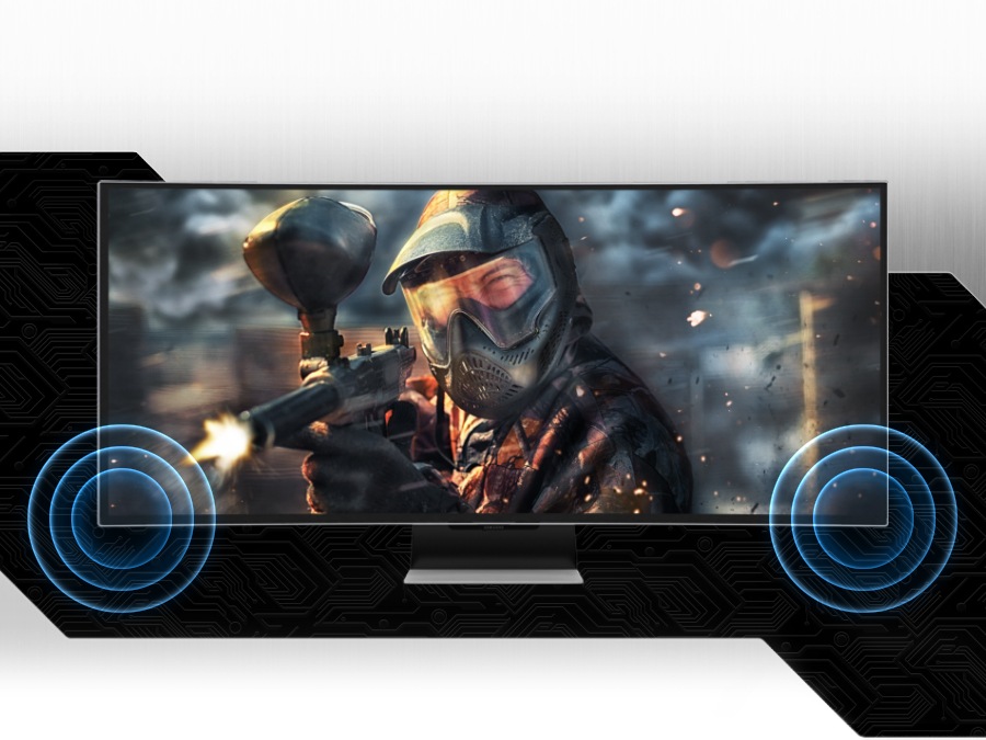 An Odyssey monitor has built-in speakers in the left and right corners of the bottom of the monitor and it creates a sound effect. The screen shows a character playing paintball pointing a gun at the front.