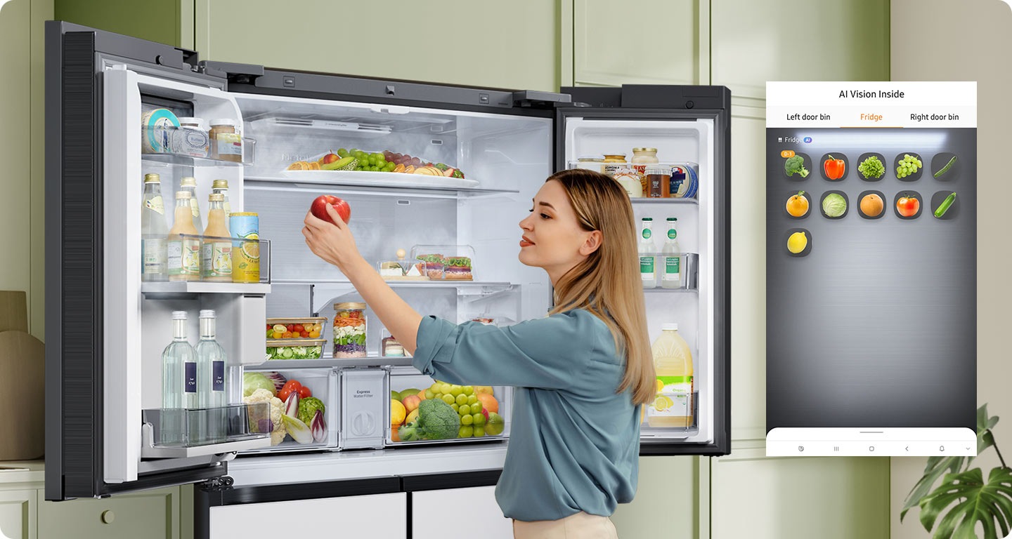 A Bespoke refrigerator filled with fresh ingredients. As the woman adds an apple to the fridge, AI Vision Inside detects the new inventory. She notices broccoli that's about to expire and takes it out of the fridge. AI Vision Inside tracks that the broccoli has been removed.