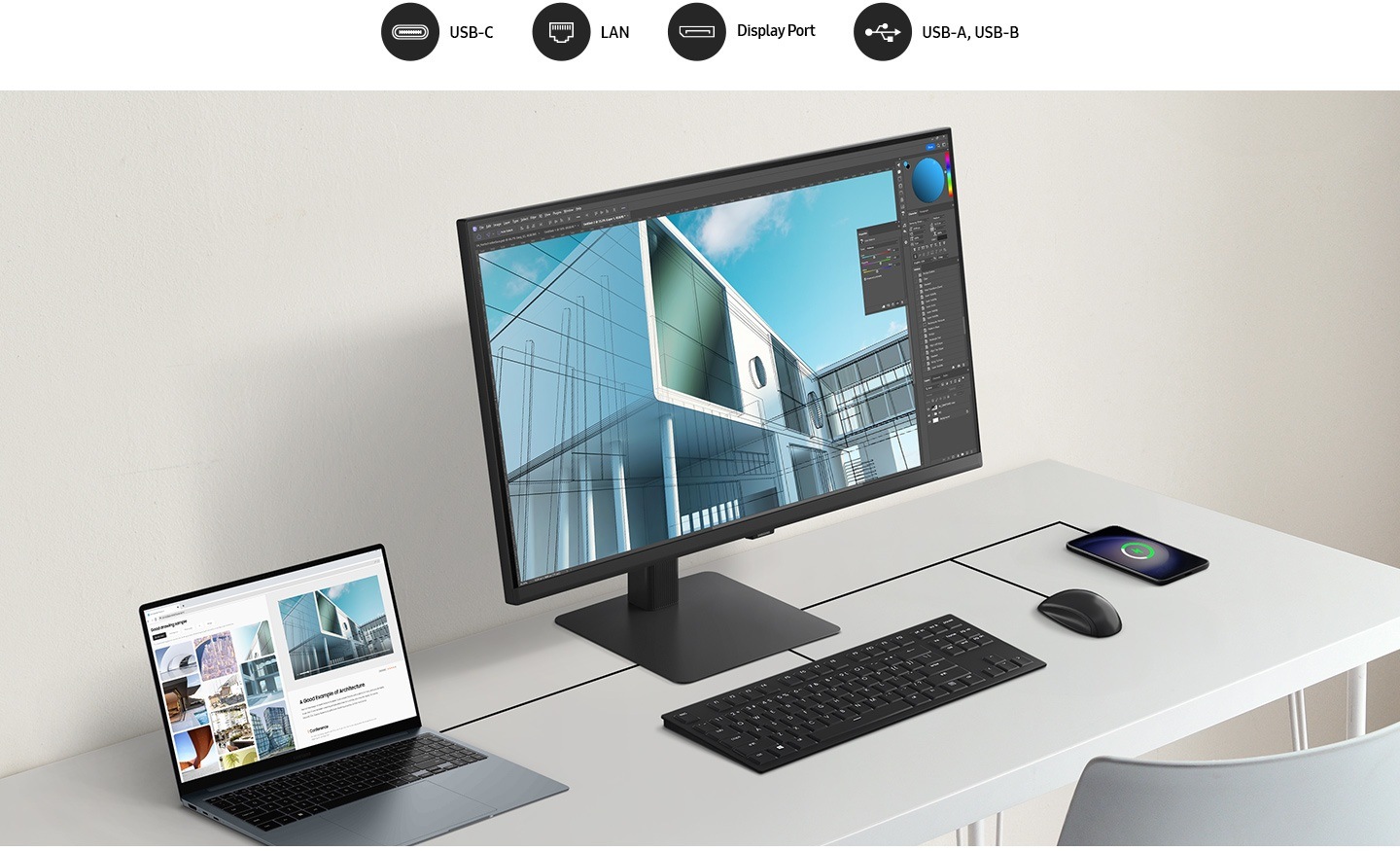 A laptop, monitor, keyboard, mouse and mobile phone are all connected on a desk by a wire. Above the monitor, there are 4 icons, which are USB-C, LAN, Display Port, USB-A and USB-B.
