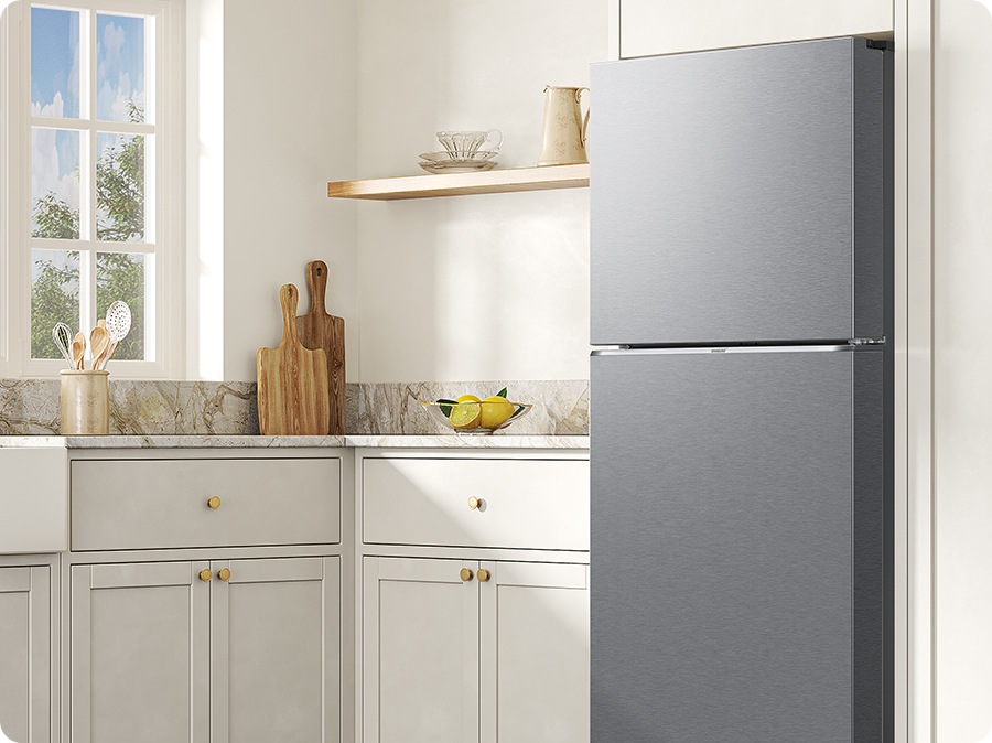 The sleek exterior of the refrigerator gives a clean look to the modern kitchen, with a flat finish.