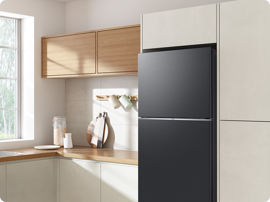 The sleek exterior of the refrigerator gives a clean look to the modern kitchen, with a flat finish.