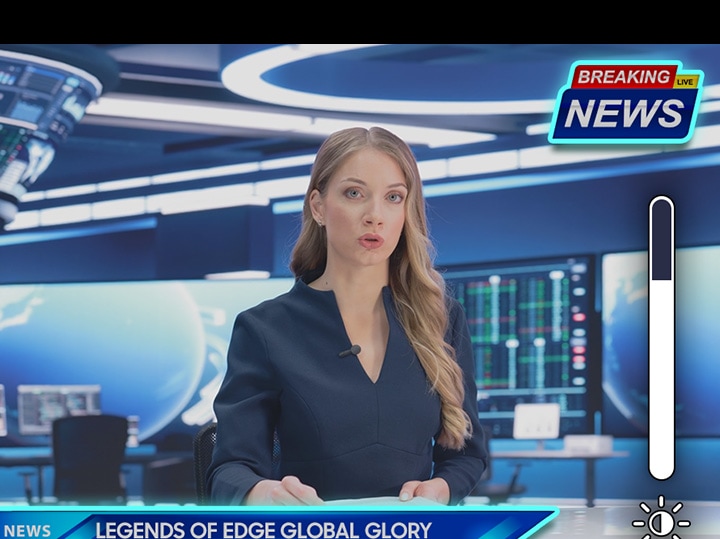 TV anchor presenting the news. Icon for brightness shows logo and taskbar reducing in brightness.